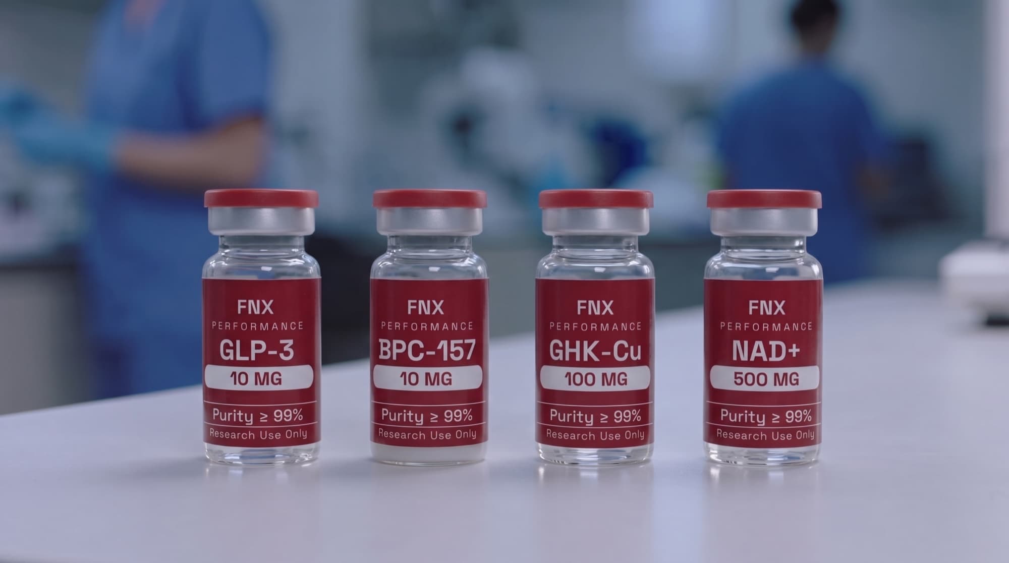 Four Fnx compound vials on a laboratory bench